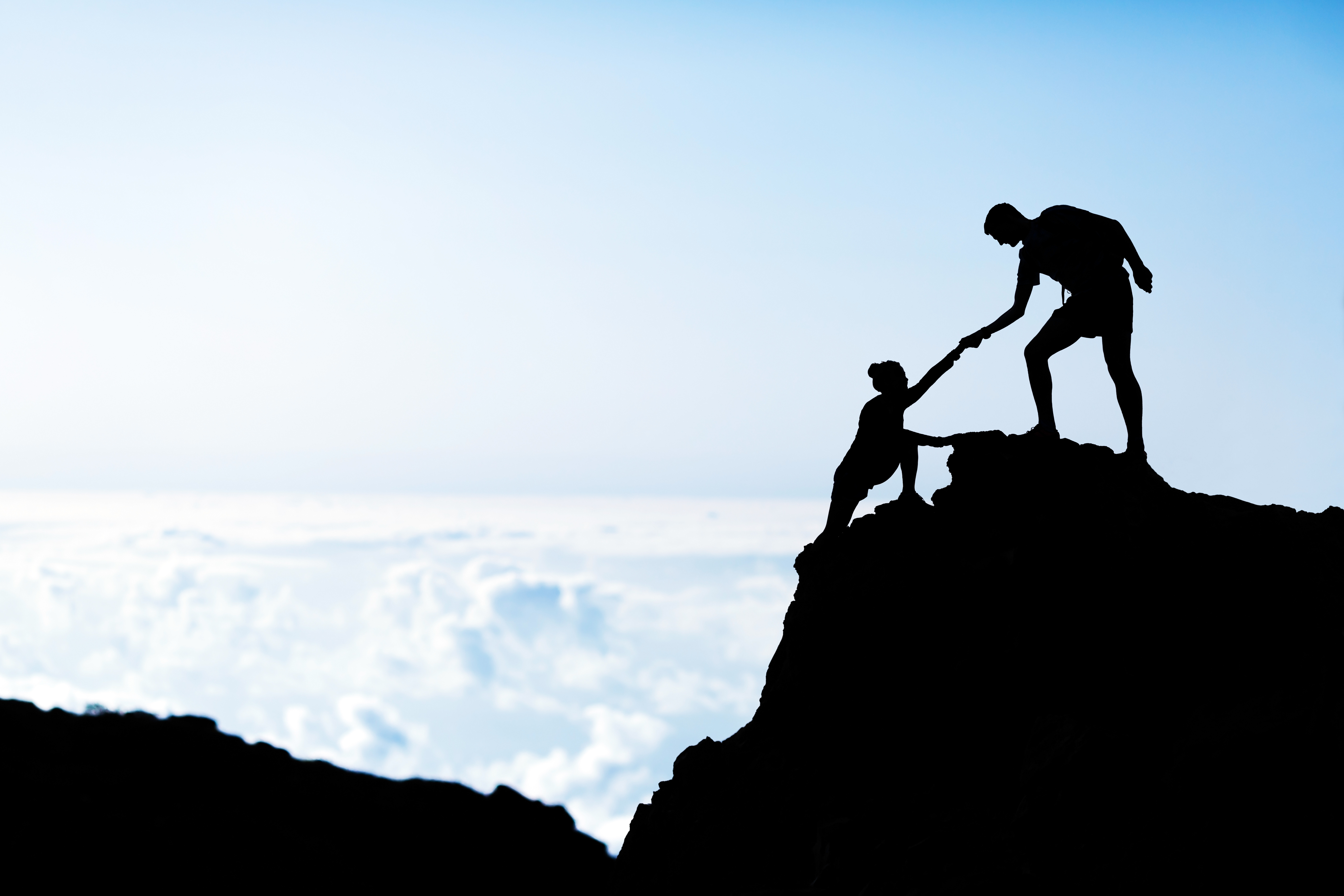 climbers helping each other